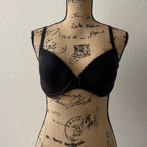 Soft black cotton T-shirt bra. Black lace trim.  Polka dot inner lining.